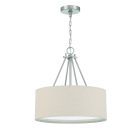 The Duke - 56593 is a modern pendant light with a beige linen drum shade. It provides warm illumination, supported by a metallic chain and rod to a circular ceiling mount. Clean lines and neutral tones give it an inviting contemporary look.