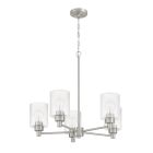 A part of the Lyndsey collection, the Lyndsey - 60225 chandelier by Craftmade showcases modern elegance with five clear textured glass shades arranged circularly around a metallic rod. It hangs elegantly from a short chain connected to a round ceiling pla