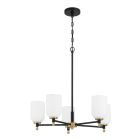 The Council - 60325-FBSB is a contemporary chandelier featuring five white frosted glass shades, a sleek black metal rod and circular base, and satin brass accents at each arm, combining modern elegance with sophisticated design.